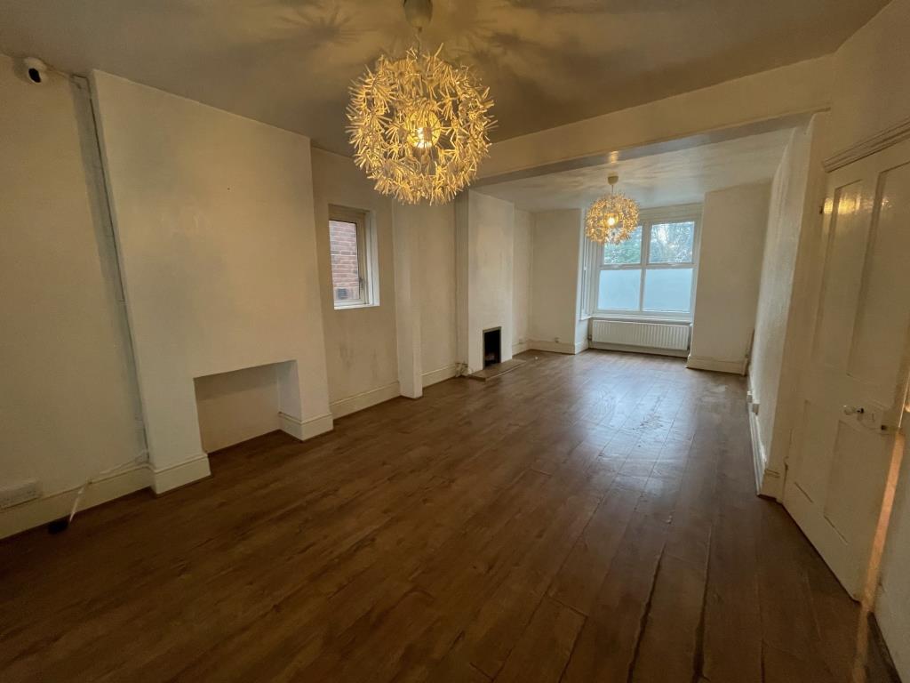 Lot: 3 - THREE-BEDROOM HOUSE IN POPULAR LOCATION - Living room looking toward the front of the house